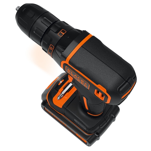 A BLACK+DECKER cordless power drill with a black and orange design, showing the drill bit and ergonomic handle. The drill features adjustable settings on the top and a battery pack at the base.