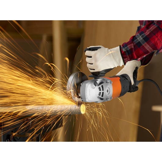 A metal pole being grinded with the BLACK+DECKER® 2200W 230mm Electric Large Angle Grinder.