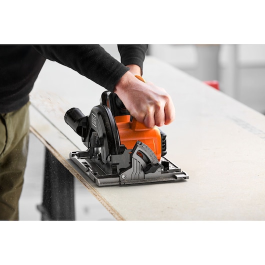 Photo of BLACKDECKER BLCCS78E1 circular saw cutting wood, close-up of tool in use.