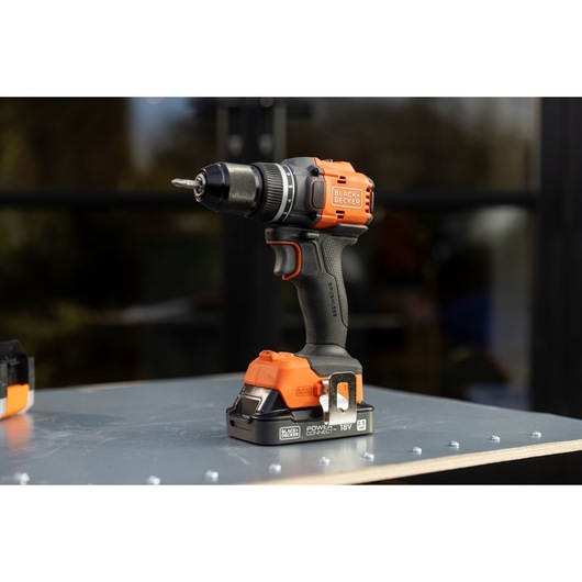 BLACKDECKER BLD782E2K cordless drill with black and orange design on a metal surface.