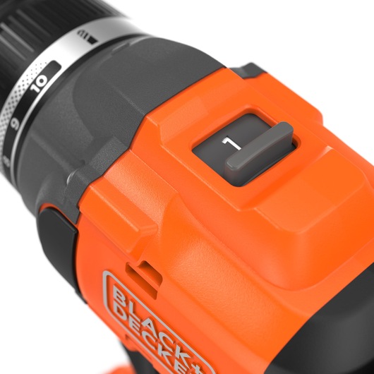 Close-up of BLACKDECKER BLD782E2K orange cordless drill gear selector and grip, left angle, white background.