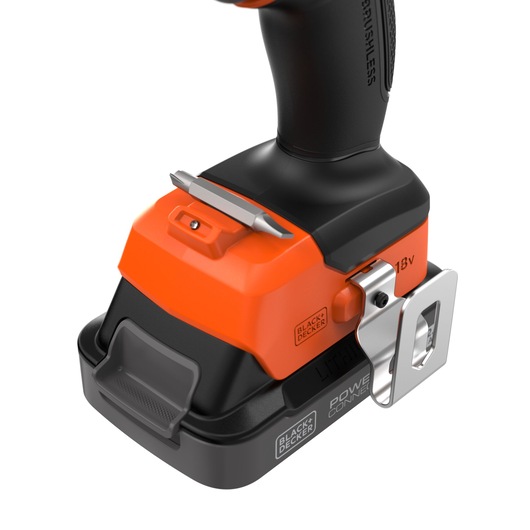 Photo of BLACKDECKER BLD782E2K cordless drill base, orange and black, 18V battery, with bit holder and belt clip, side angle.