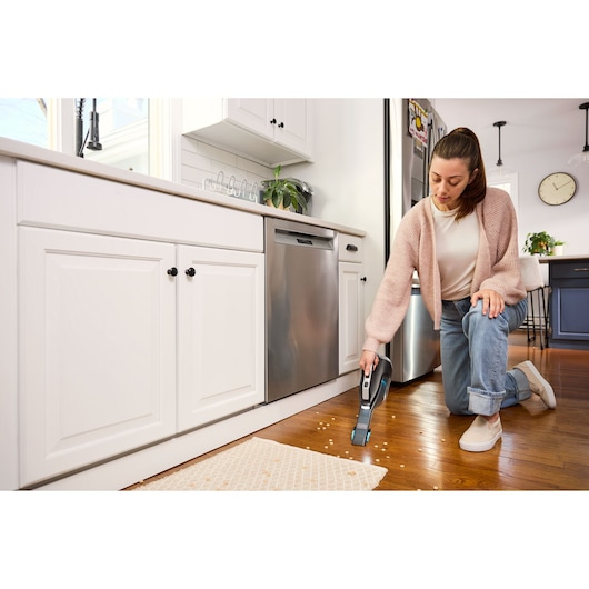 Cordless handheld vacuum cleaner with charging base and onboard LED
