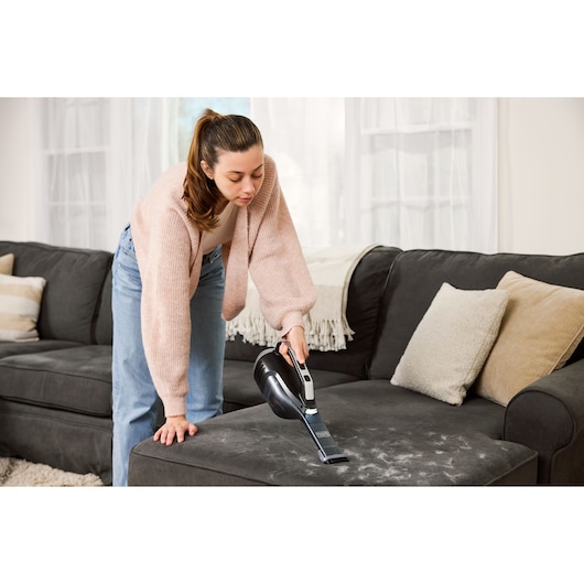 Cordless handheld vacuum cleaner with jack plug and onboard LED