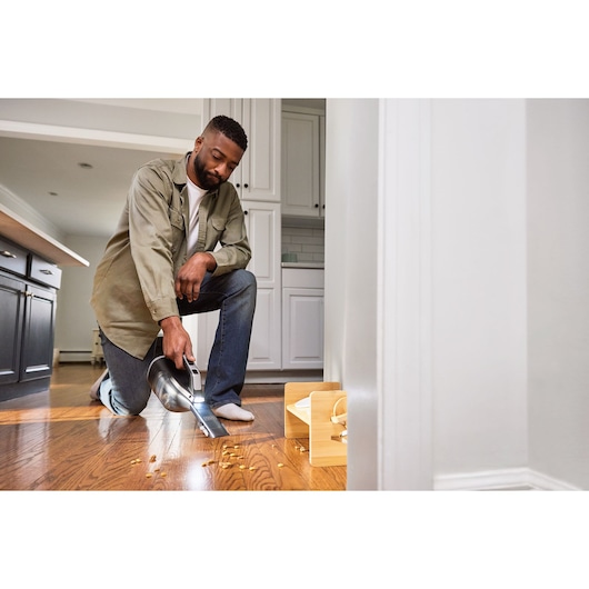 Cordless handheld vacuum cleaner with jack plug and onboard LED