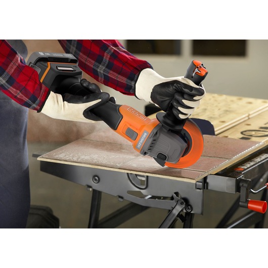 A metal sheet being cut with the BLACK+DECKER® 18V POWERCONNECT™ Brushless Angle Grinder.
