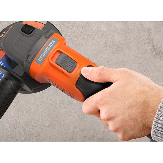 The power switch of the BLACK+DECKER® 18V POWERCONNECT™ Brushless Angle Grinder.