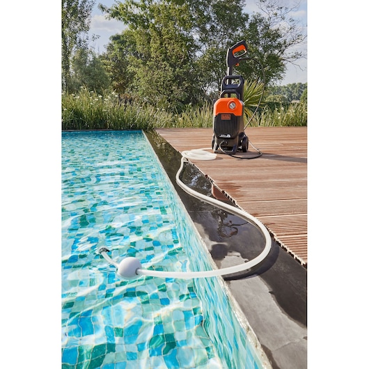 The BLACK+DECKER 2000W Corded Pressure Washer (150 Bar) self-priming from a swimming pool.