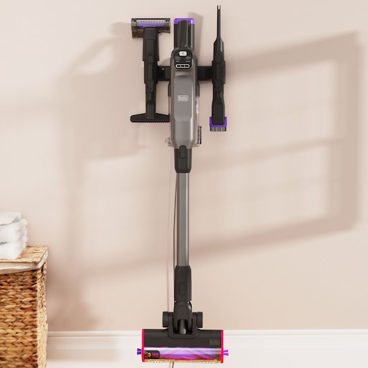 BLACK+DECKER SUMMITSERIES Stick Vac hanging on wall with attachments