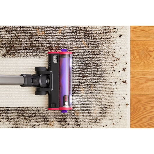 BLACK+DECKER SUMMITSERIES cordless stick vacuum vacuuming heavy dirt off rug