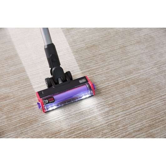 BLACK+DECKER SUMMITSERIES cordless stick vacuum vacuuming heavy dirt off rug