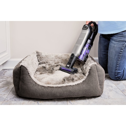 BLACK+DECKER SUMMITSERIES Cordless Stick Vacuum vacuuming pet bed with motorized pet brush