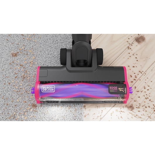 The floorhead in action on a hardwood floor and carpet using its LED headlights - BLACK+DECKER SUMMITSERIES select Pet cordless stick vacuum.