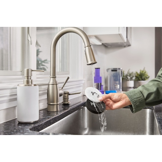 BLACK+DECKER SUMMITSERIES cordless stick vacuum filter being washed