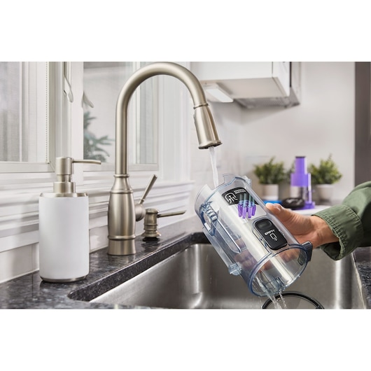 BLACK+DECKER SUMMITSERIES cordless stick vacuum dustbowl being washed