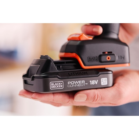 A POWERCONNECT™ battery pack being inserted into the BLACK+DECKER® 18V Brushless Drill Driver.